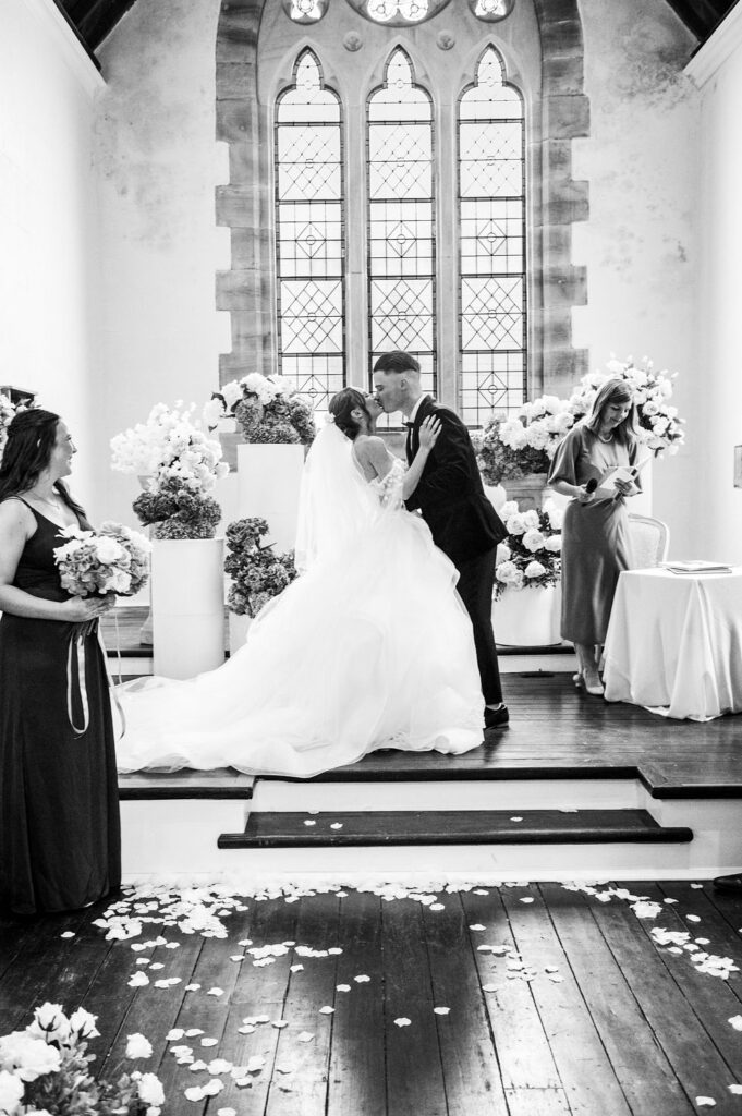 bride and groom kiss at Lords Estate