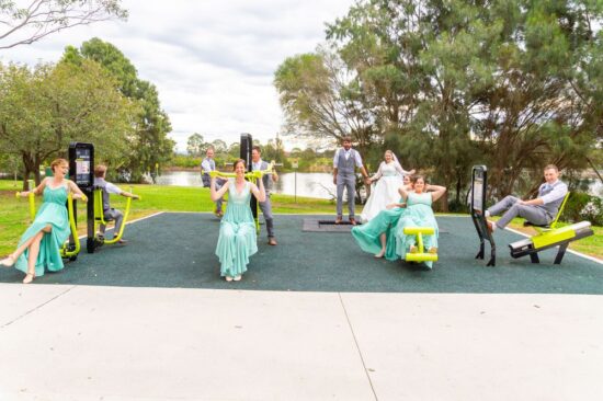 Bridal party having fun with their wedding photos Bridal party having fun with their wedding photos