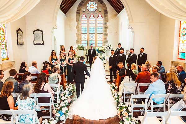 Bride walking down isle at Lords Estate