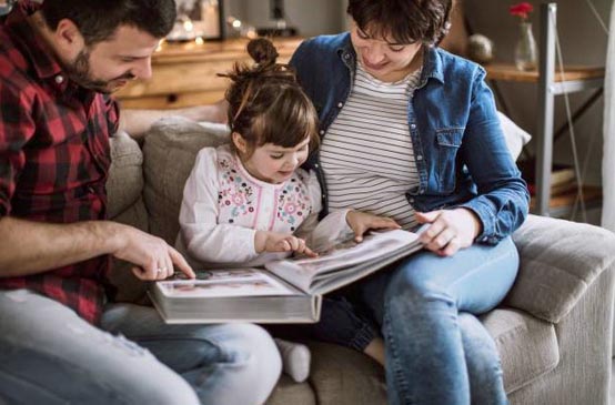 family viewing wedding album