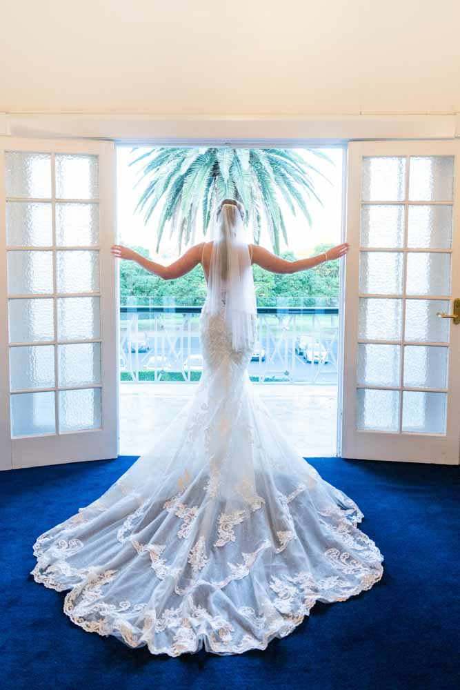 Elegant wedding reception inside Cropley House ballroom with chandeliers and classic décor